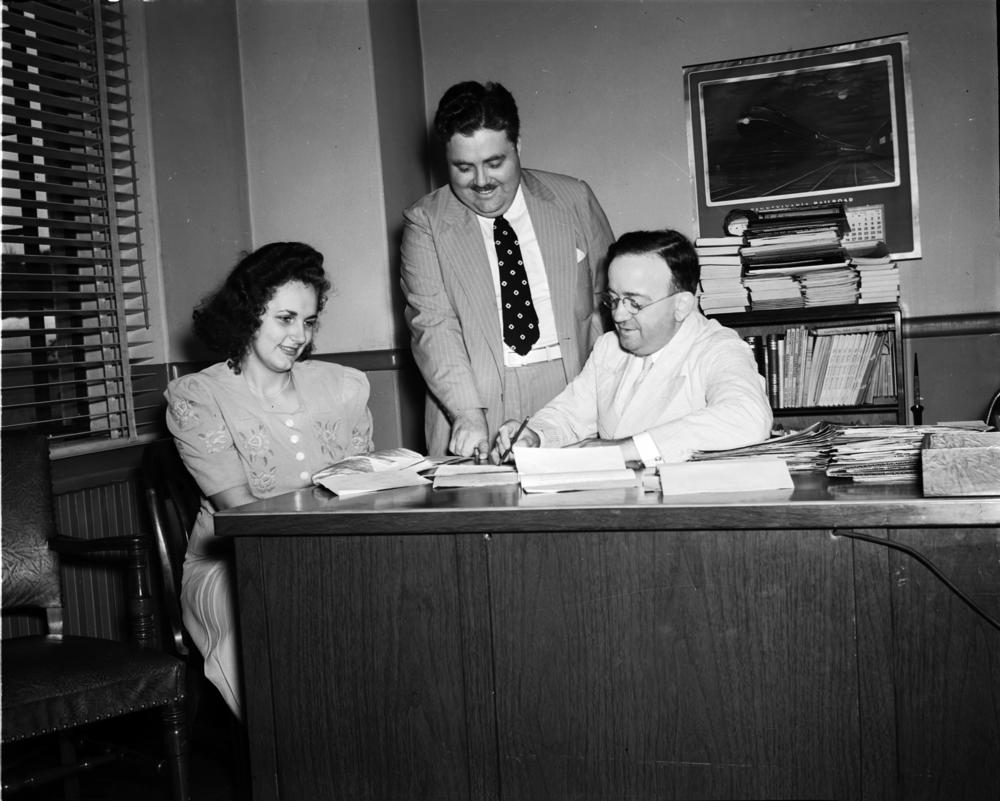 Black and white photo of Louise McNutt, Herman B Wells and Frank Elliott