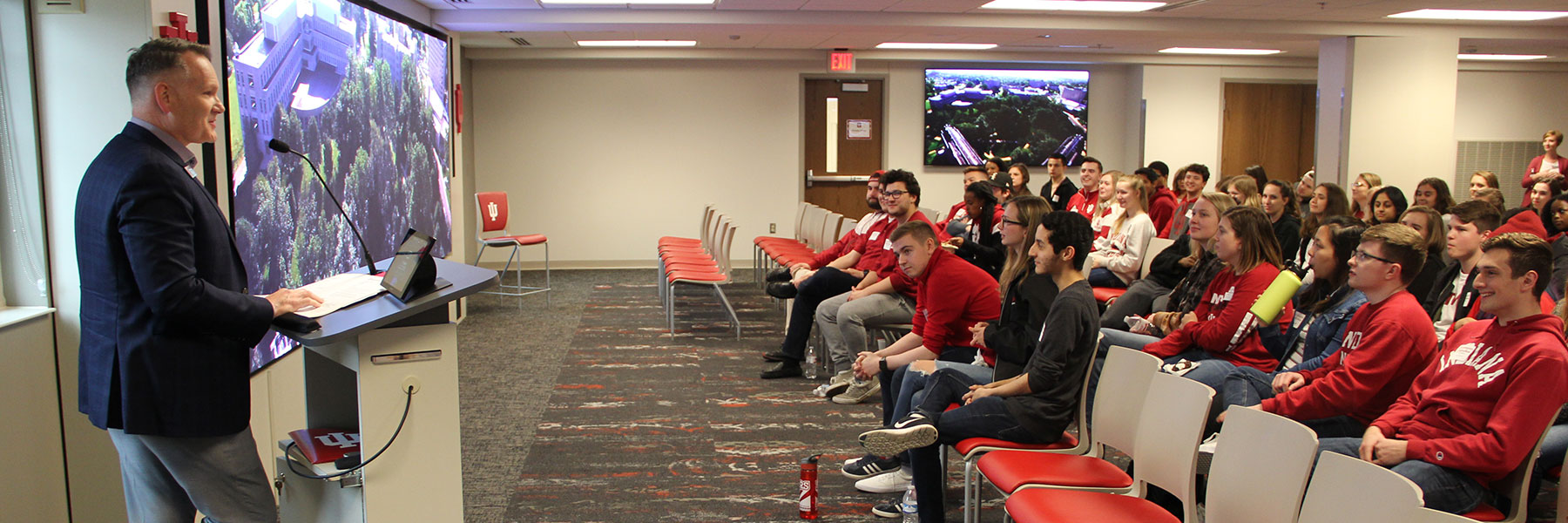 Vice provost, David B. Johnson speaking in front a room full of students